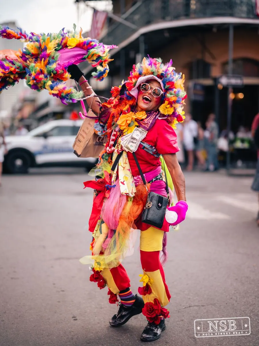 Colorfully dressed street performer at Dirty Linen Night 2026 on Royal Street
