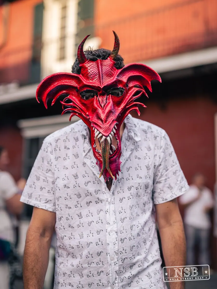 Attendee wearing a dramatic red horned mask at Dirty Linen Night 2026