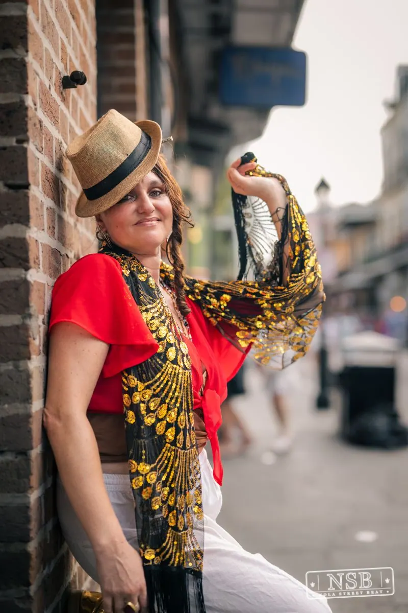 Costumed attendee in red and gold at Dirty Linen Night 2026 in New Orleans