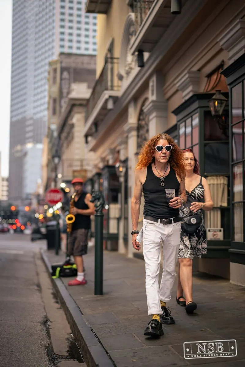 Friends walking along Royal Street at Dirty Linen Night 2026 in New Orleans