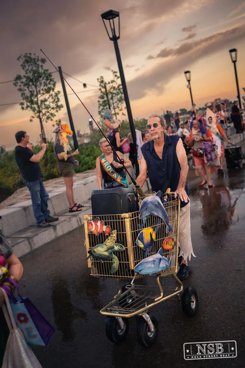 A drummer walking with the Mermaid Parade at the 2026 New Orleans Mermaid Parade