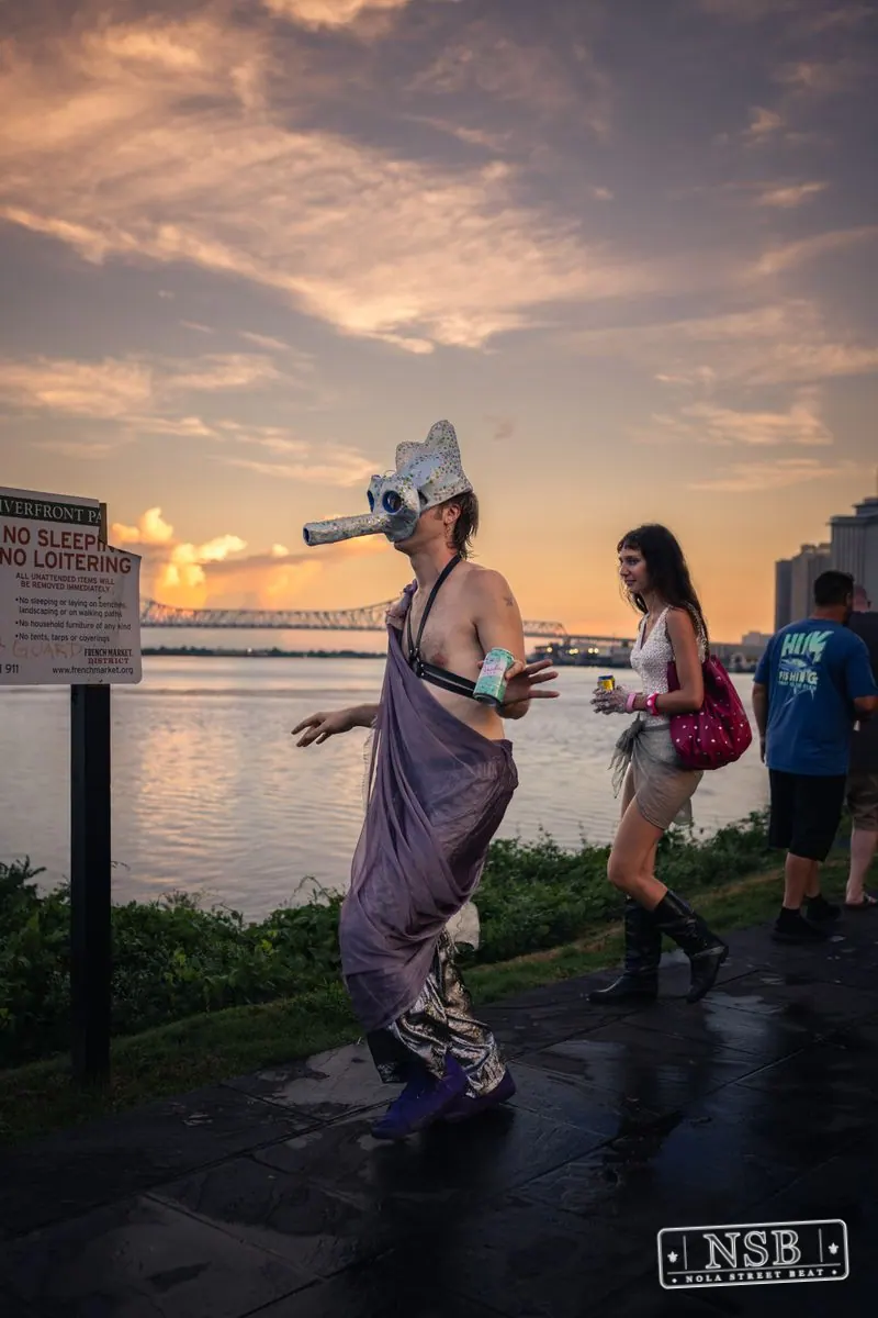 Costumed parade participants continuing along the Mississippi River at the 2026 New Orleans Mermaid Parade